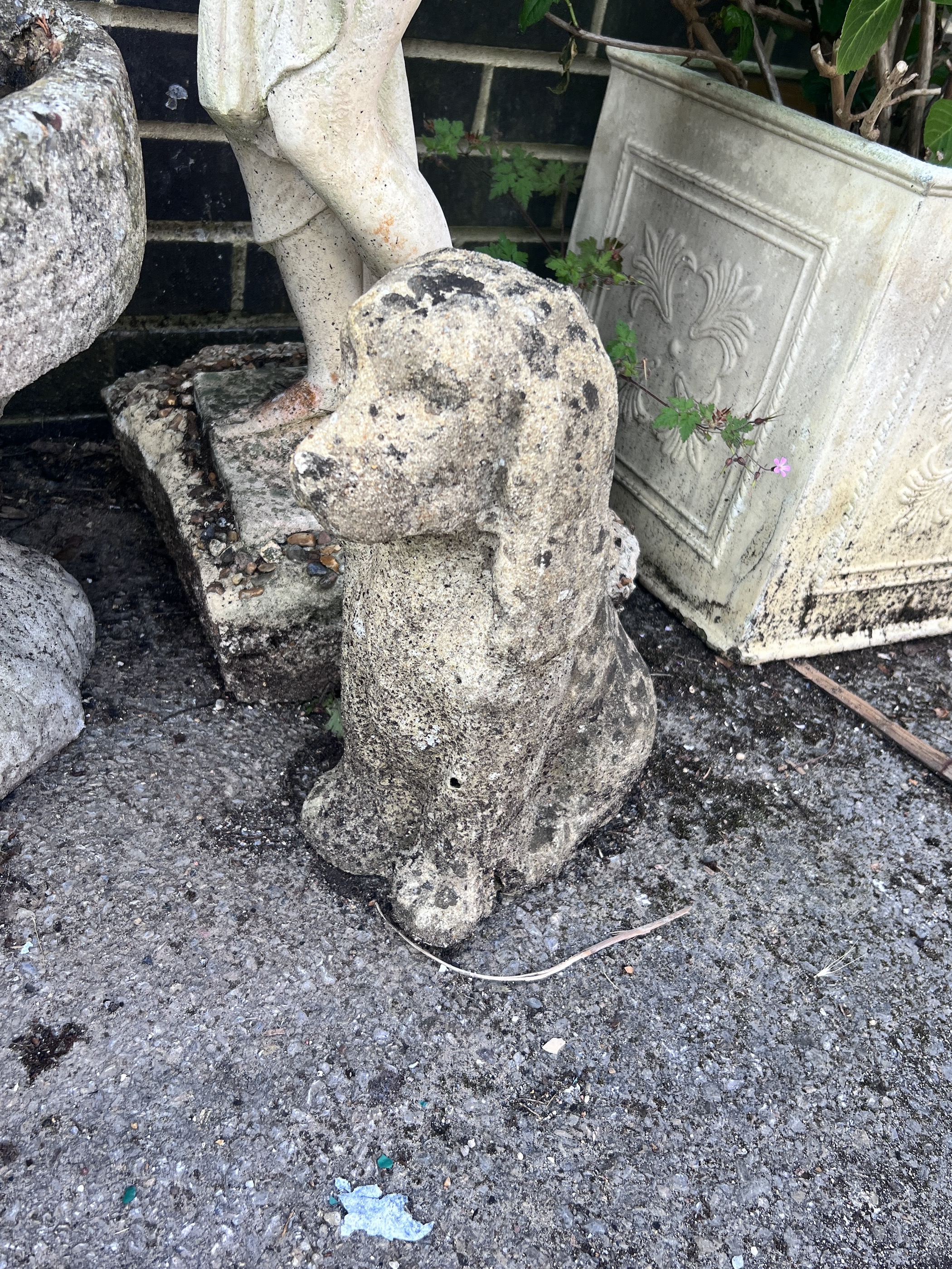 A reconstituted stone female bather garden ornament, height 78cm, together with a stone seated dog ornament